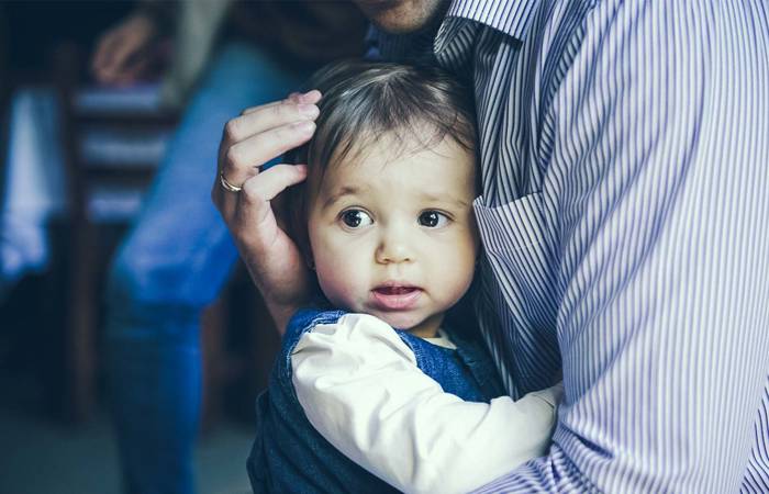 Child clinging to parent