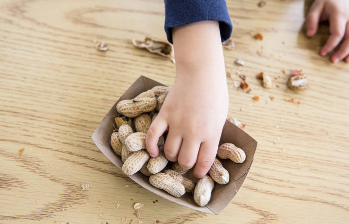 Child eating peanuts