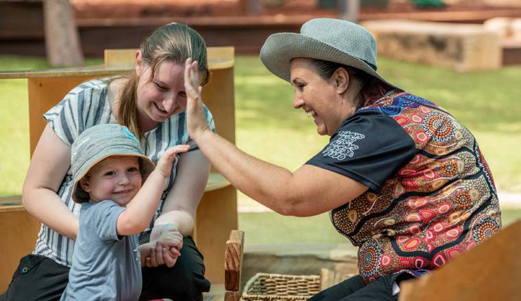 Goodstart Early Learning Centre educators with child
