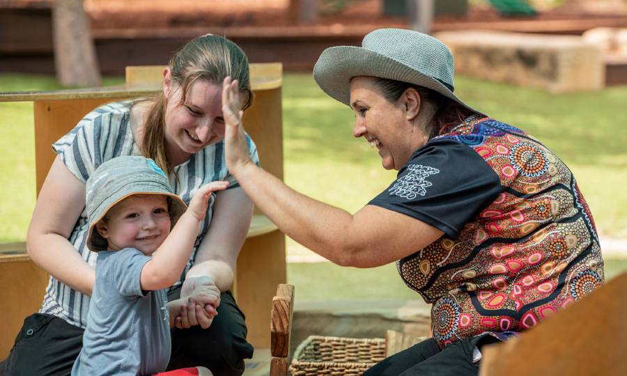 Goodstart Early Learning Centre educators with child