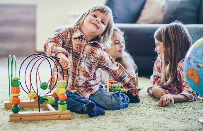 Children playing on floor with toys