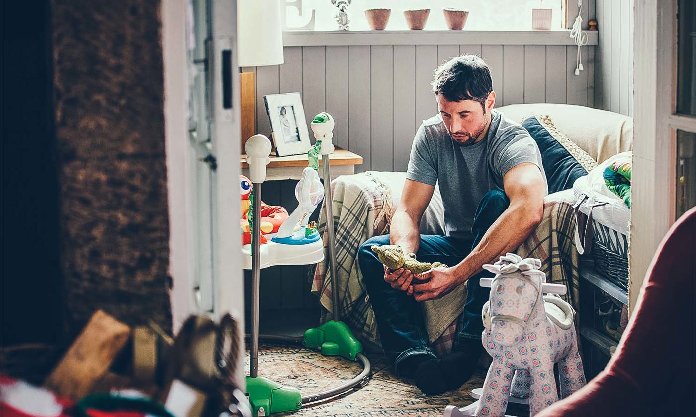 Sad father in a nursery