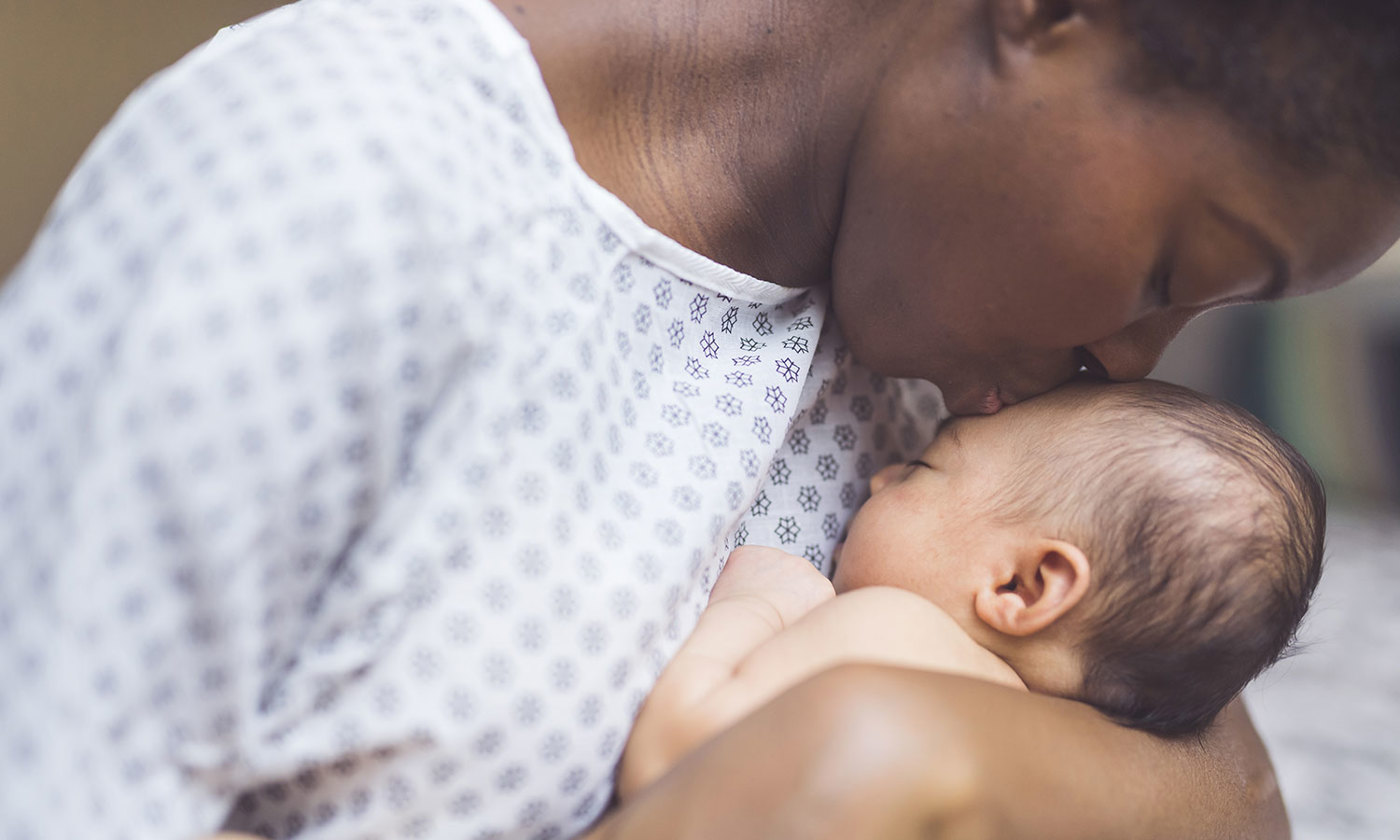 Mother holds newborn