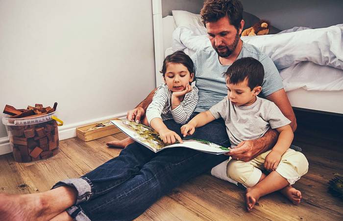 Father reading with children