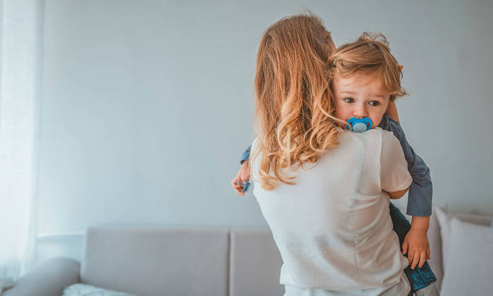 Mother holding baby son