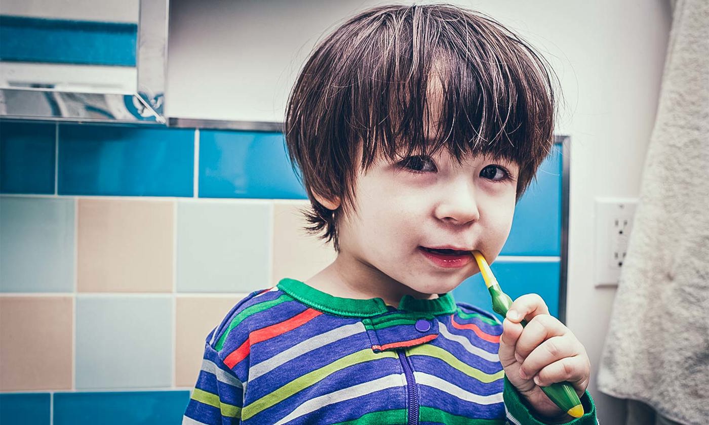 Small boy brushing his teeth