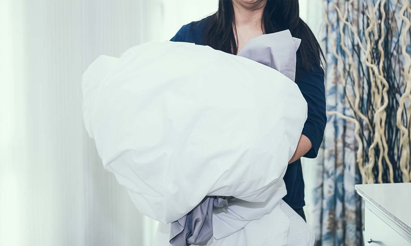 Woman washing sheets