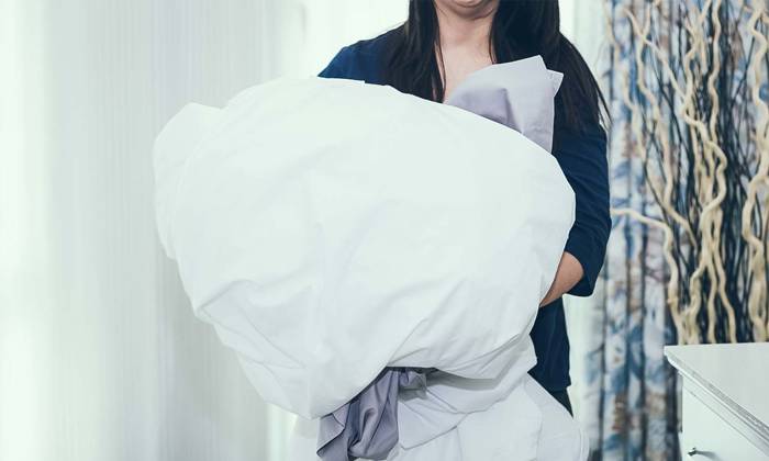 Woman washing sheets