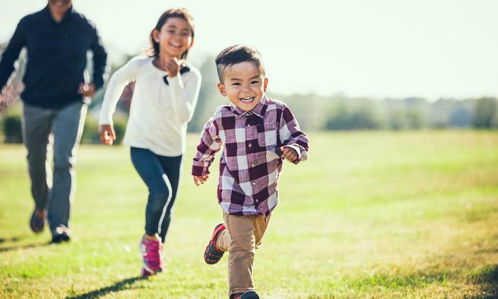 Child playing outside with Dad