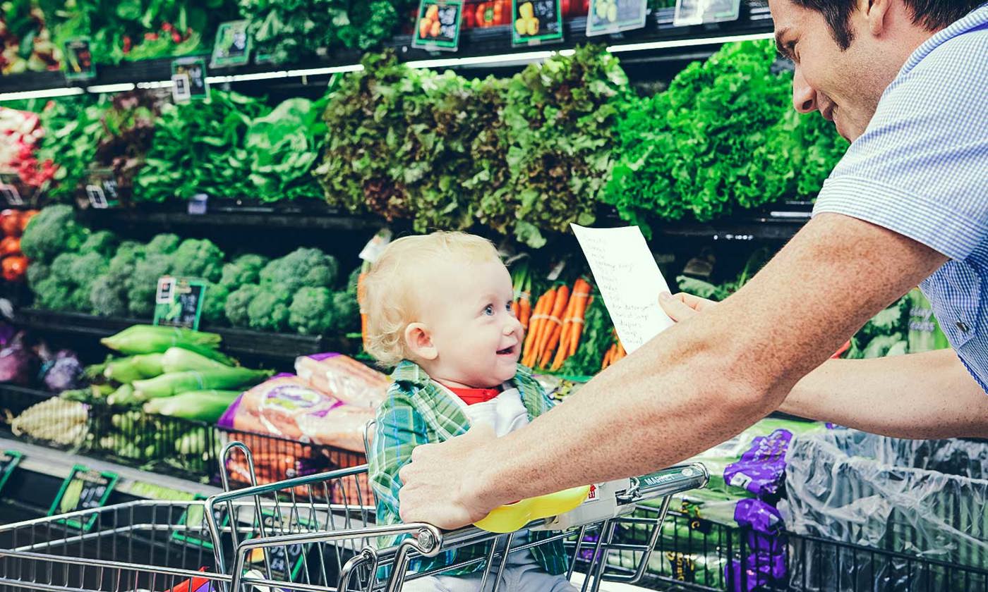 Father and child grocery shopping