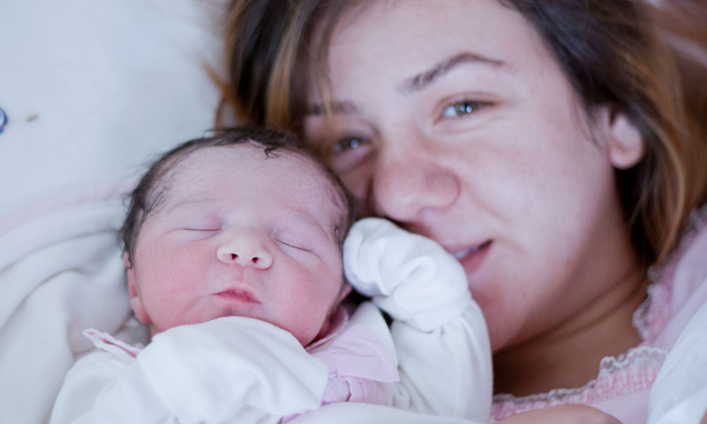 New born baby with his mother