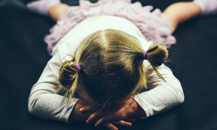 Child lying on the floor