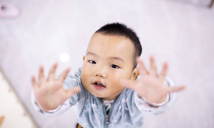 Toddler reaching for hug