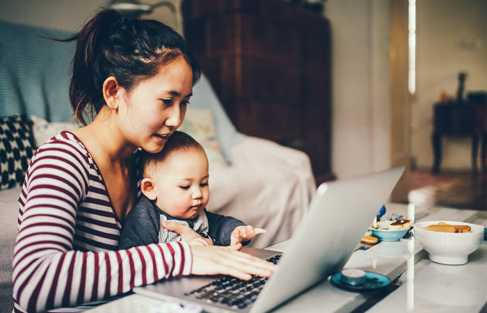Mum trying to work with her baby boy