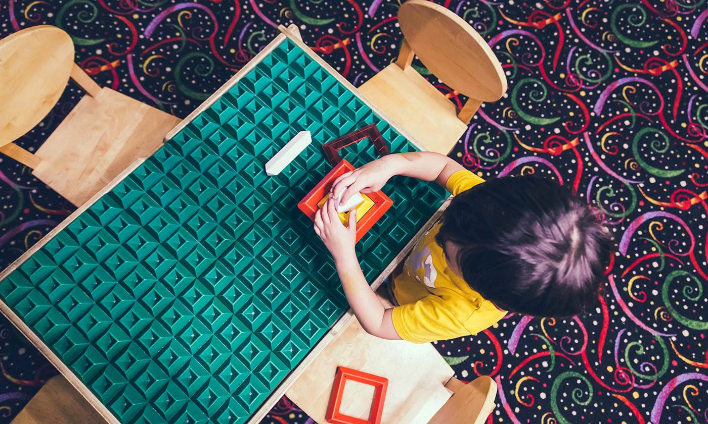 Boy playing at a table