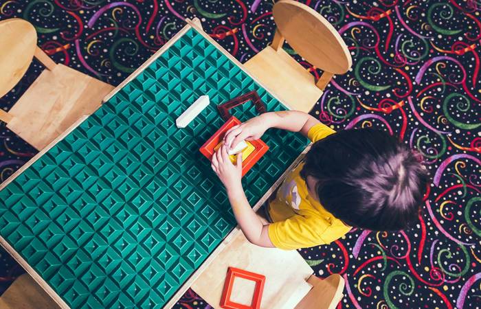 Boy playing at a table
